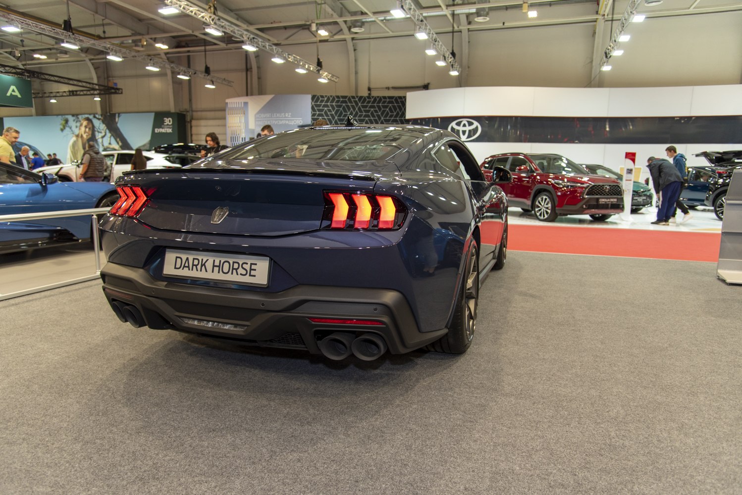 Rear view with triple-bar taillights and quad exhaust tips