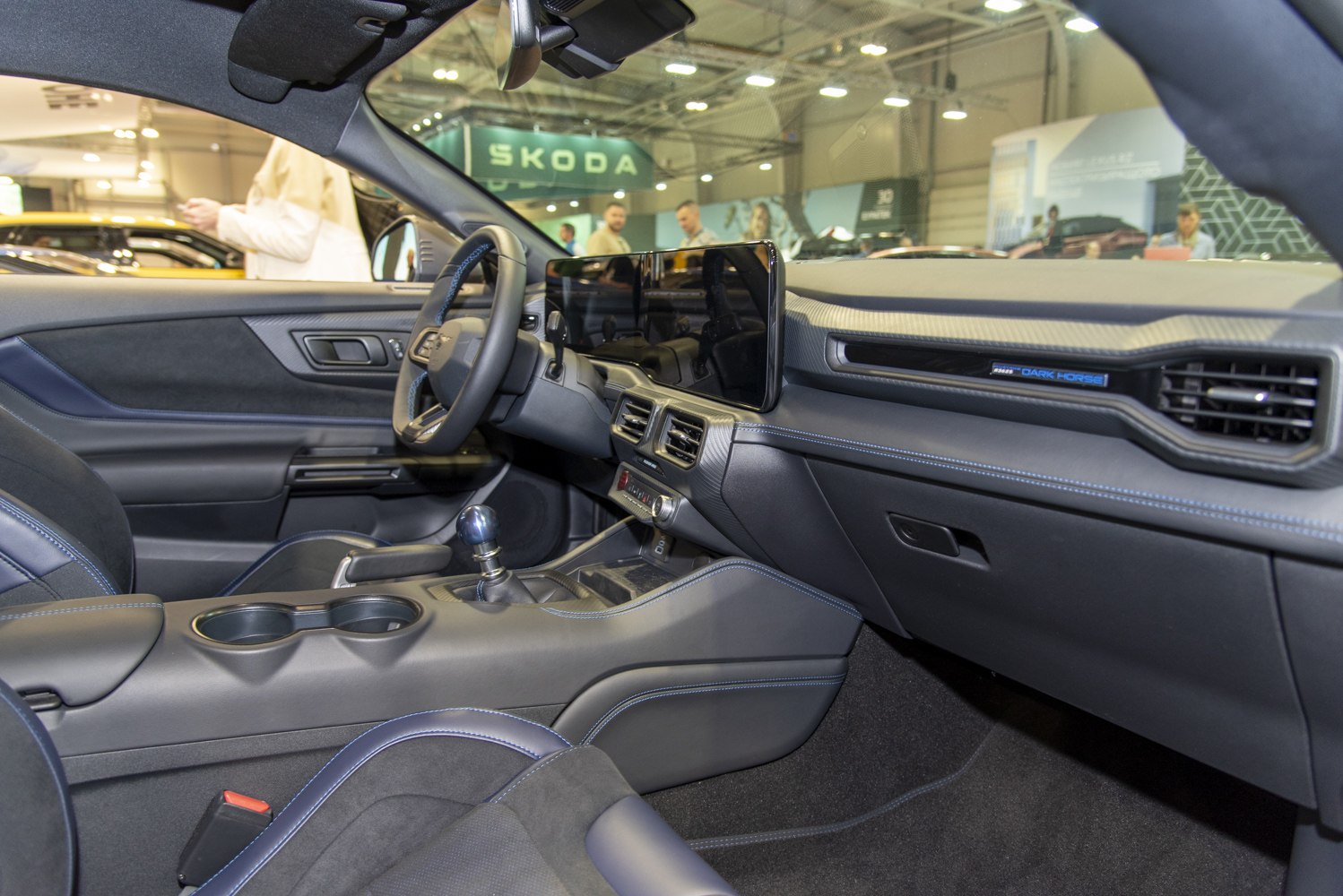 Modern car interior with touchscreen and manual gear shifter