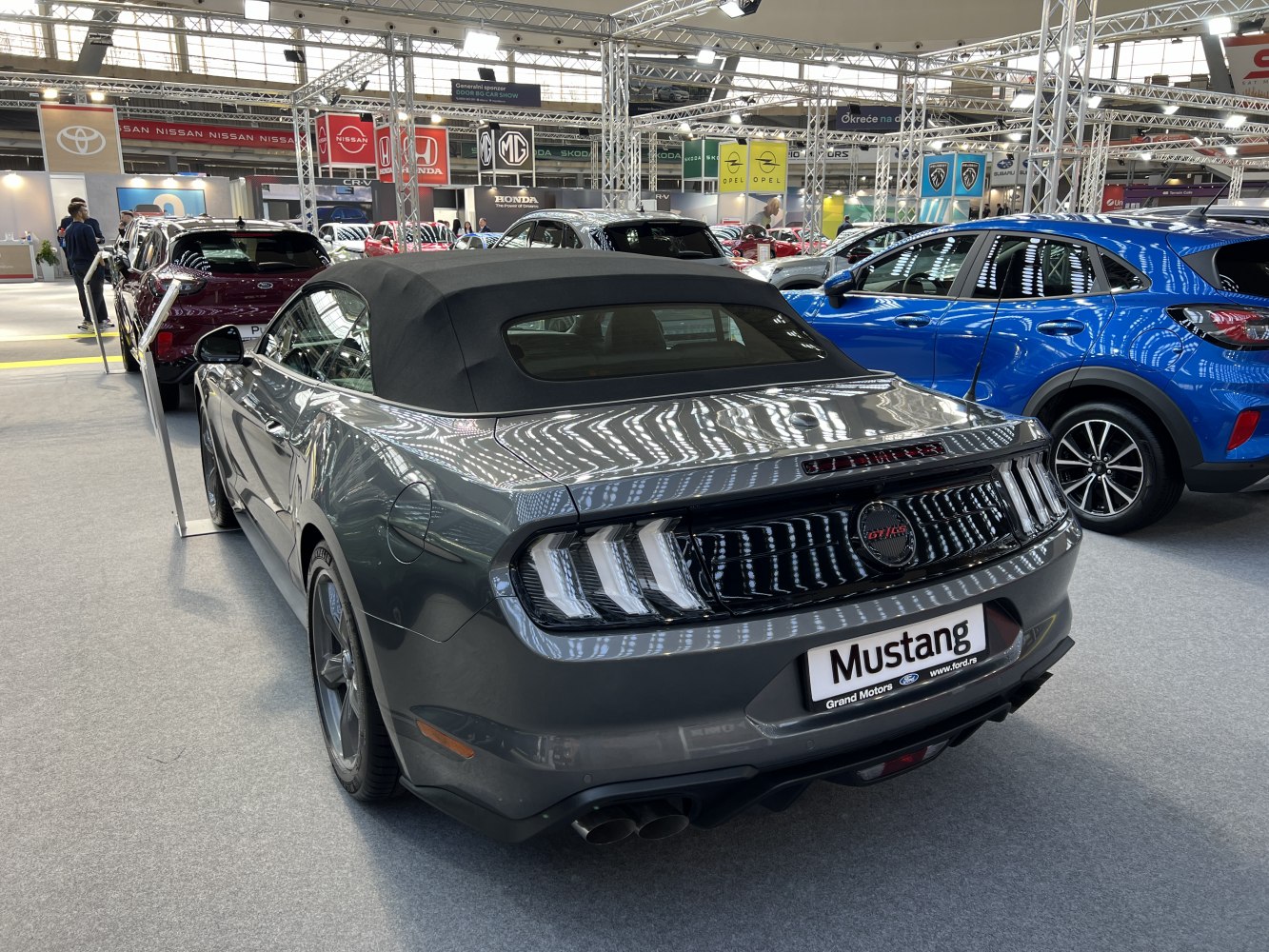 Rear view of convertible with triple-bar taillights and soft-top roof