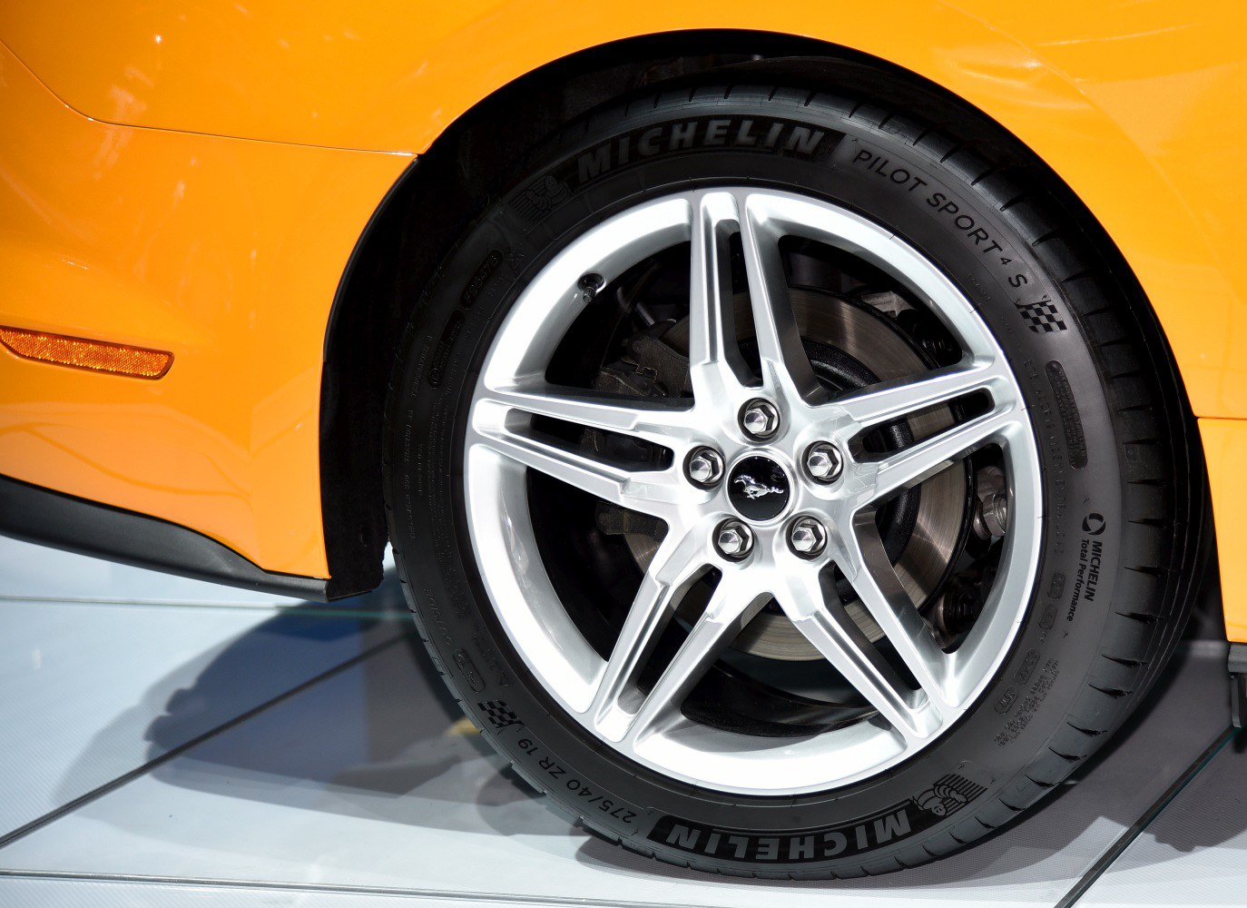 Alloy wheel with Michelin Pilot Sport 4 S tire on muscle car.