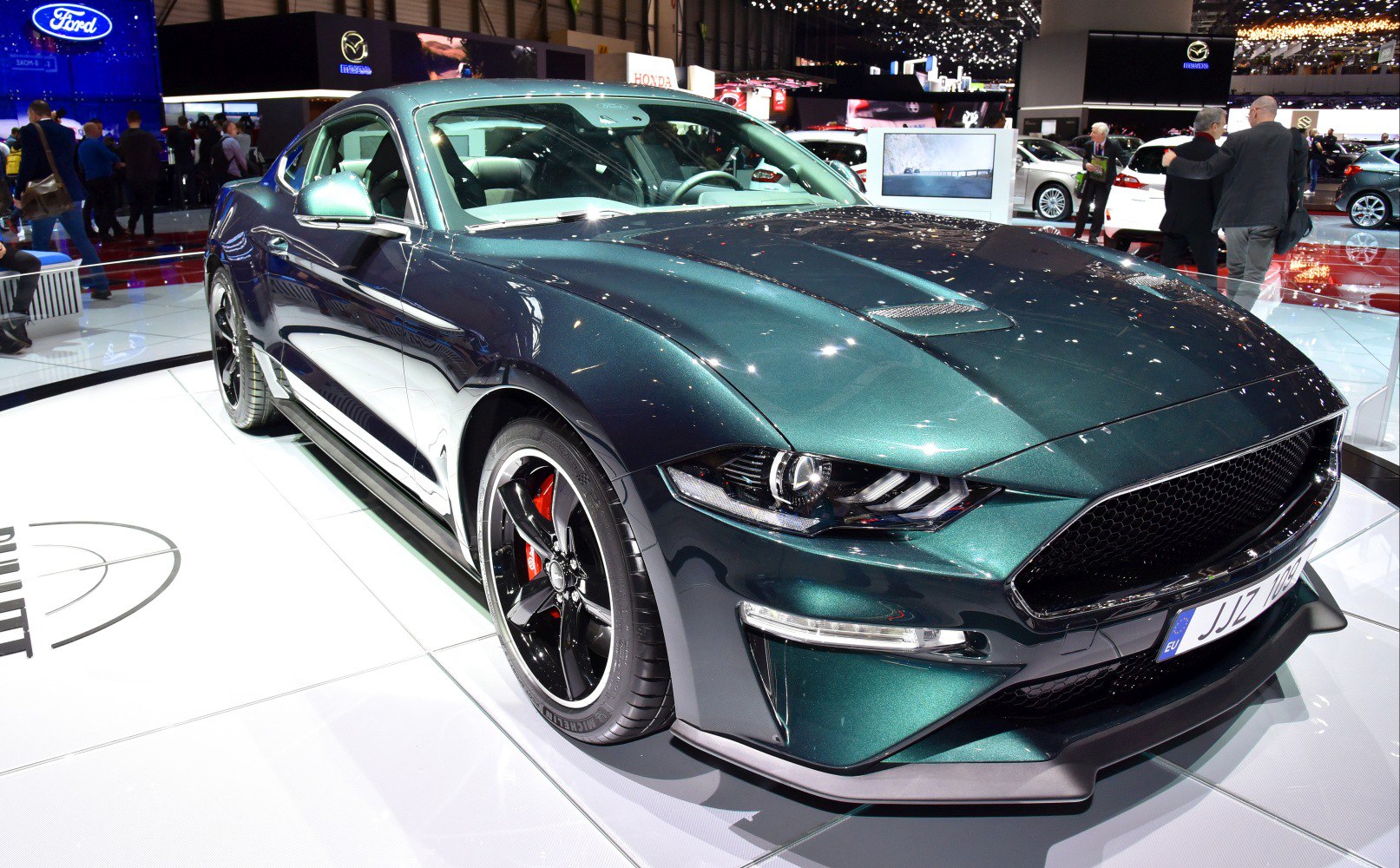 Aggressive front grille and sharp headlights of a sports coupe
