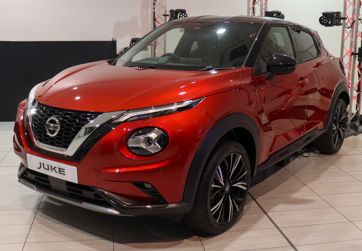 Front and side view with sleek headlights and sporty wheels