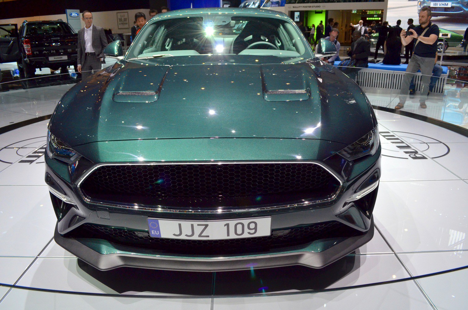Front view with aggressive grille and dual sporty hood vents