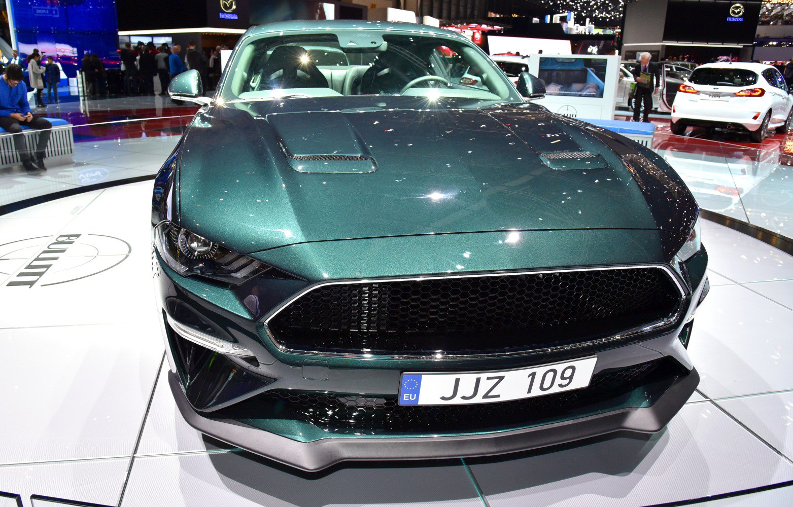 Aggressive front with mesh grille and dual hood vents.
