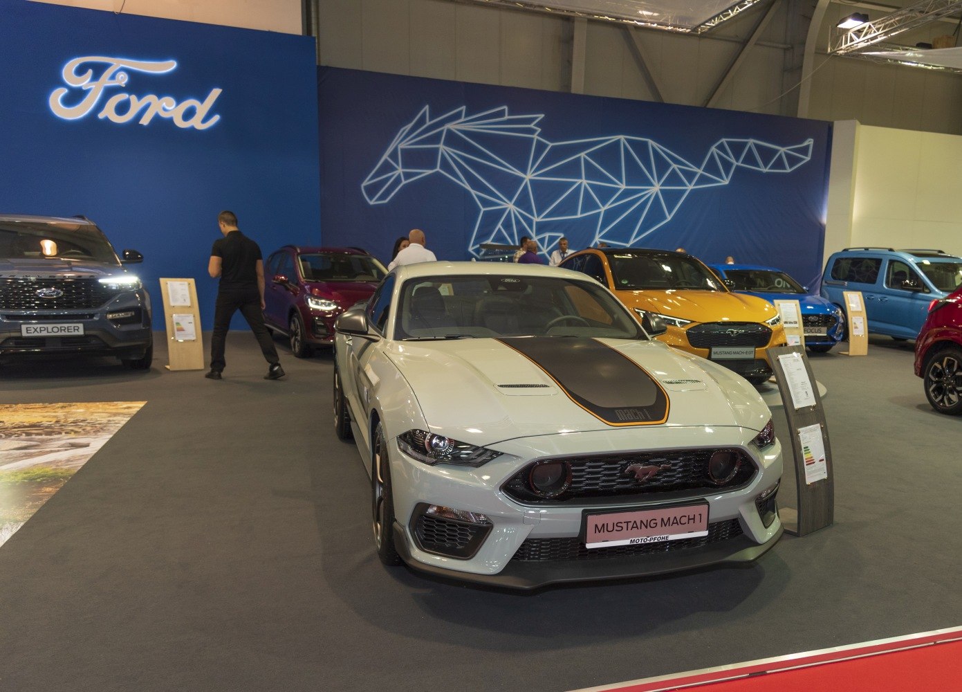 Sports coupe with aggressive grille and racing stripe