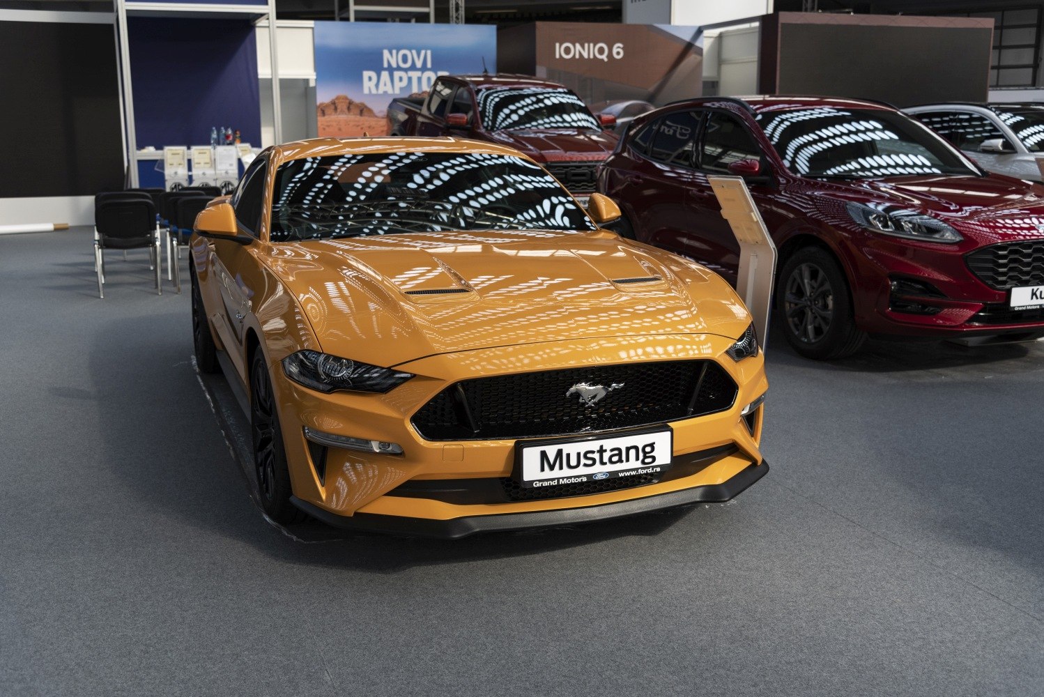 Sporty front with aggressive grille and hood vents