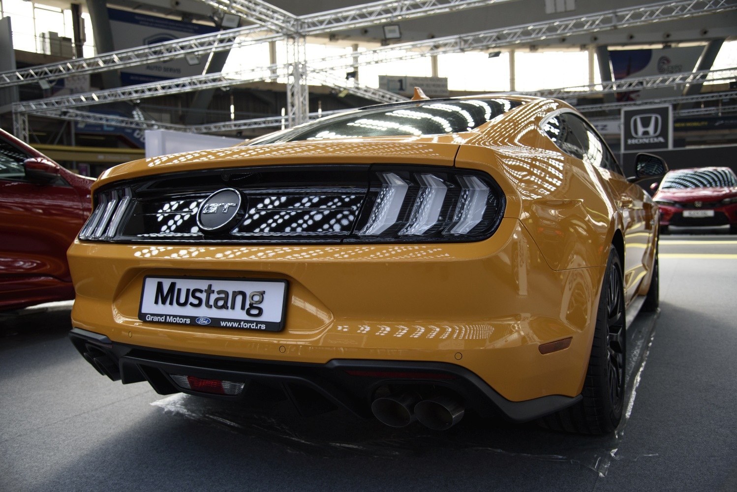 Rear view with triple-bar taillights and dual exhaust