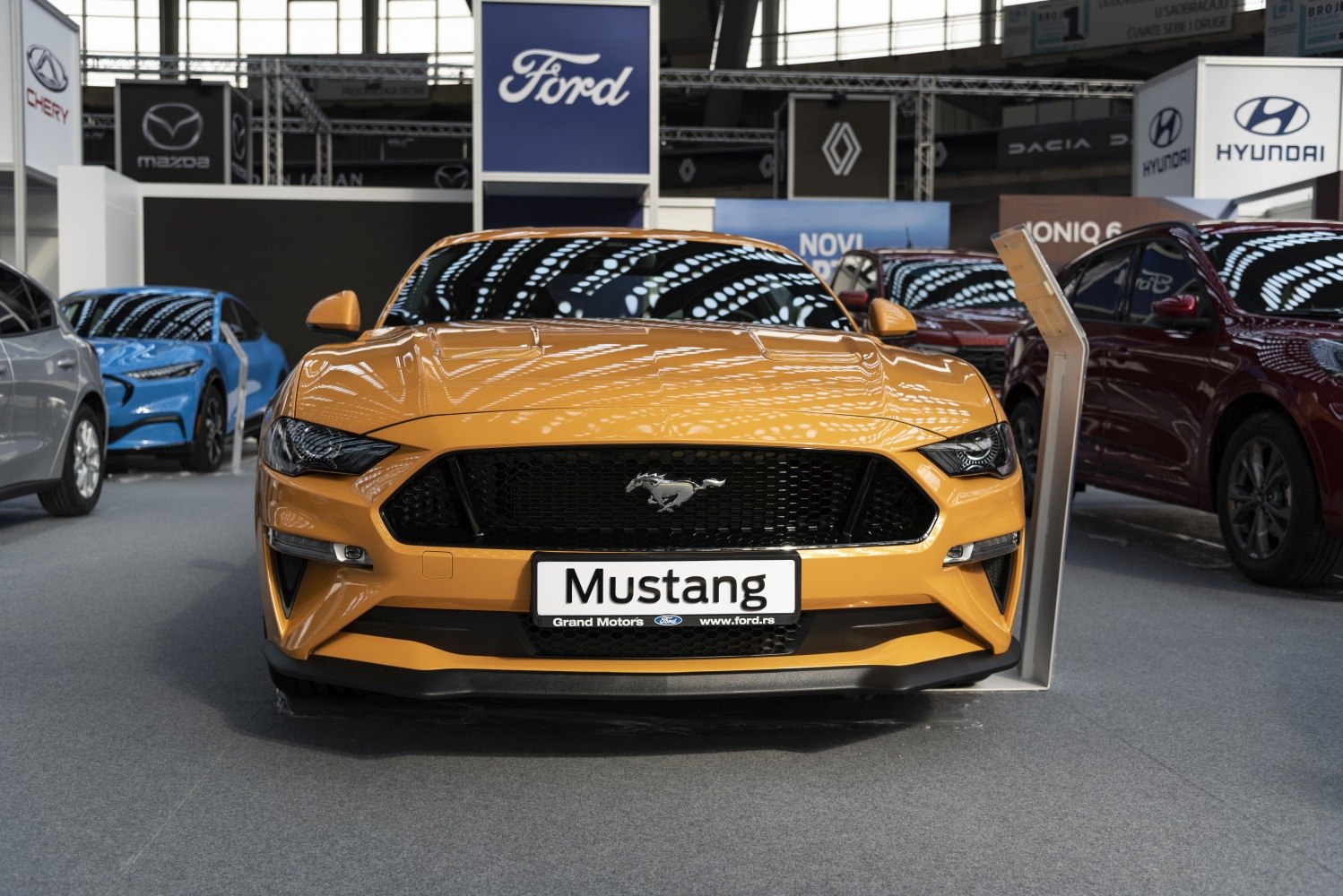 Bold front fascia with aggressive headlights and pony emblem grille