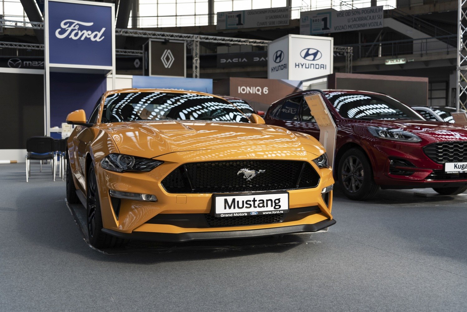 Aggressive grille and sleek headlights of a modern muscle coupe