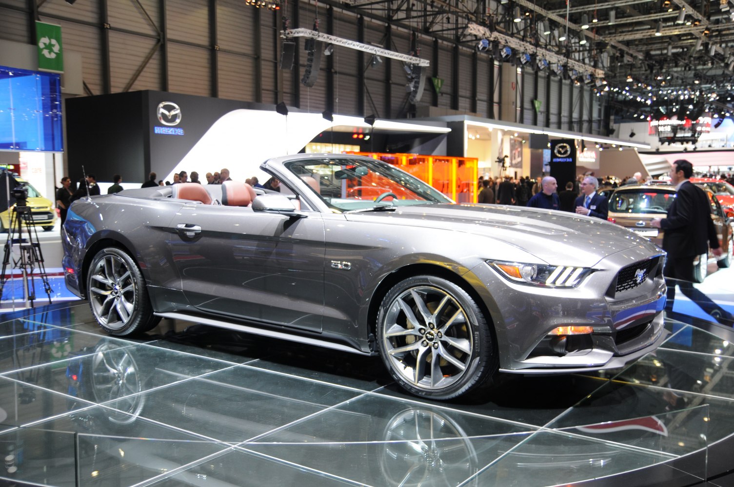 Convertible Mustang with open roof and alloy wheels