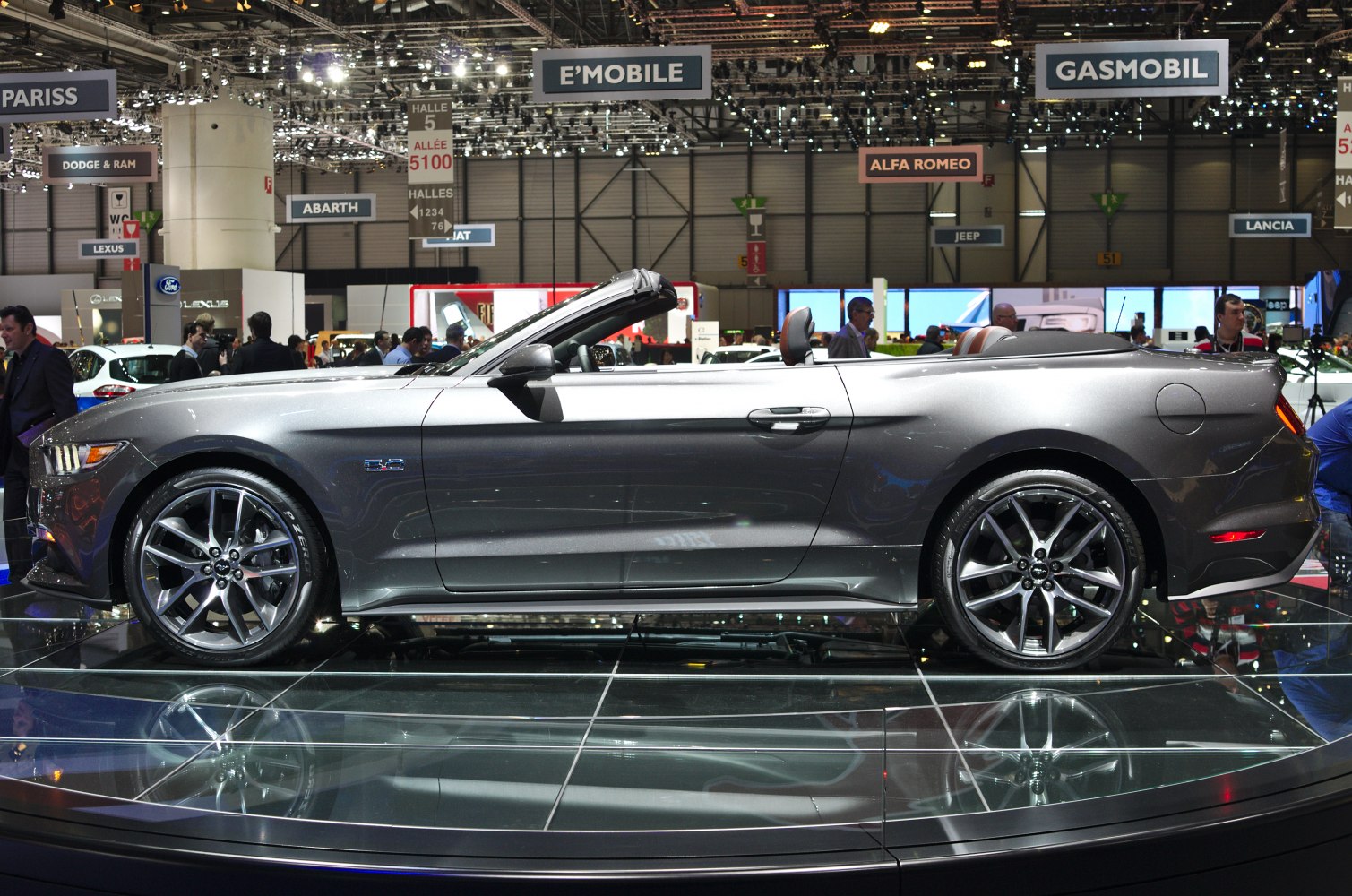 Side profile of sporty convertible with open roof and alloy wheels