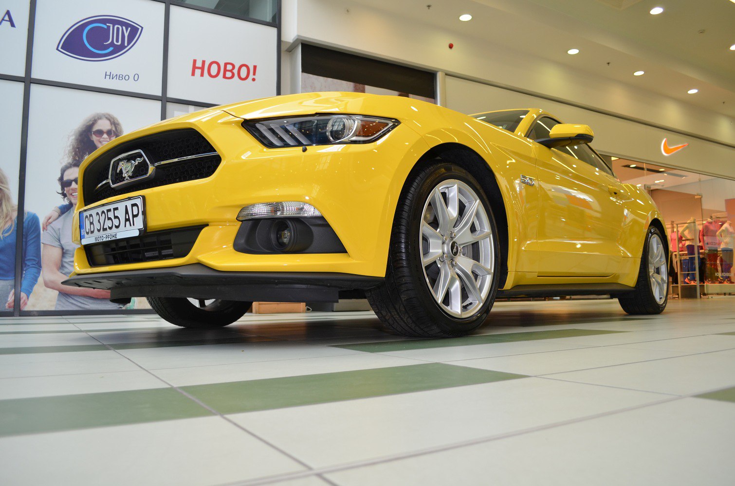 Yellow sports coupe with projector headlights and alloy wheels