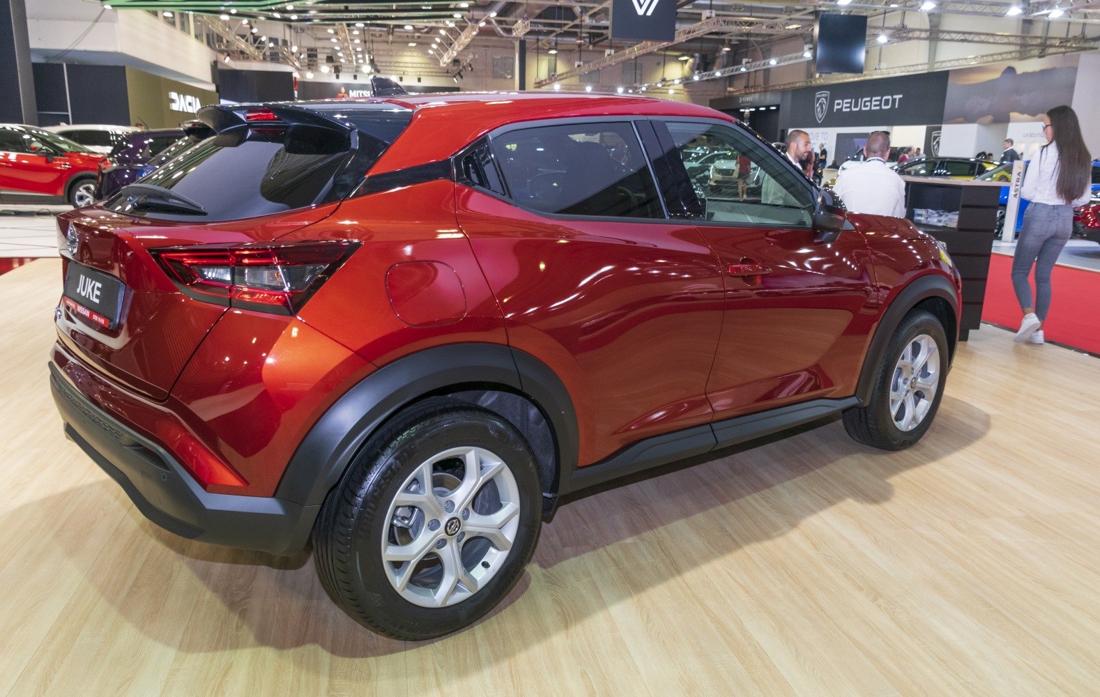 Rear and side view of sporty compact crossover with roof spoiler and alloy wheels
