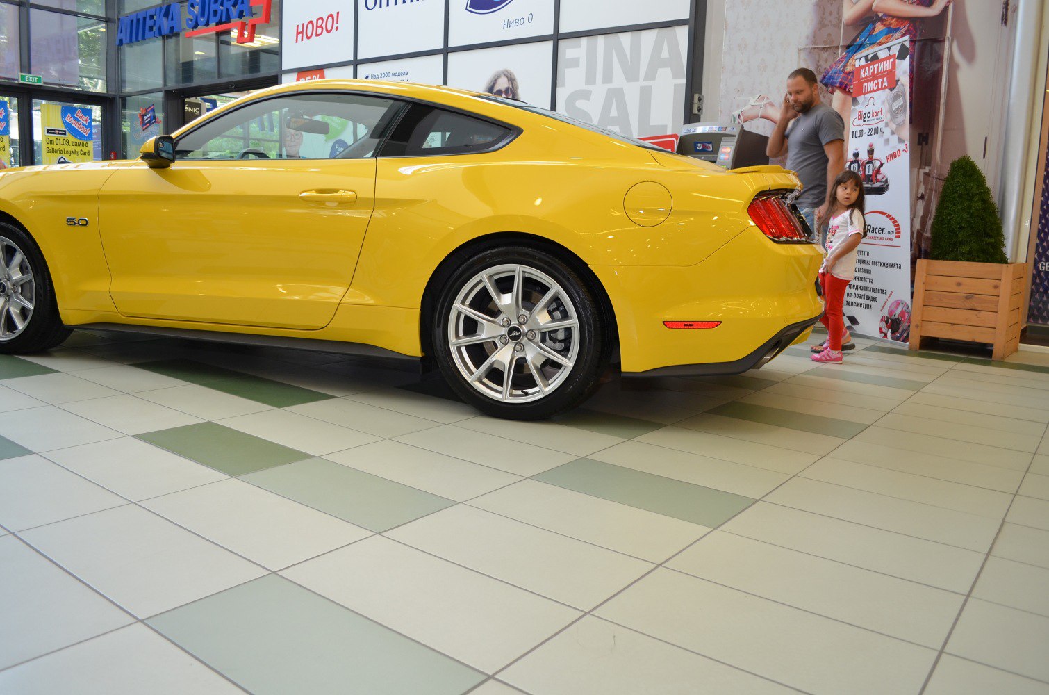 Yellow sports coupe with alloy wheels and fastback design
