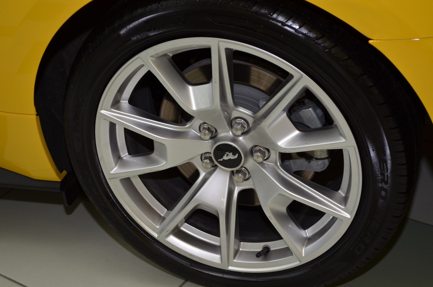 Sporty five-spoke alloy wheel with visible brake disc