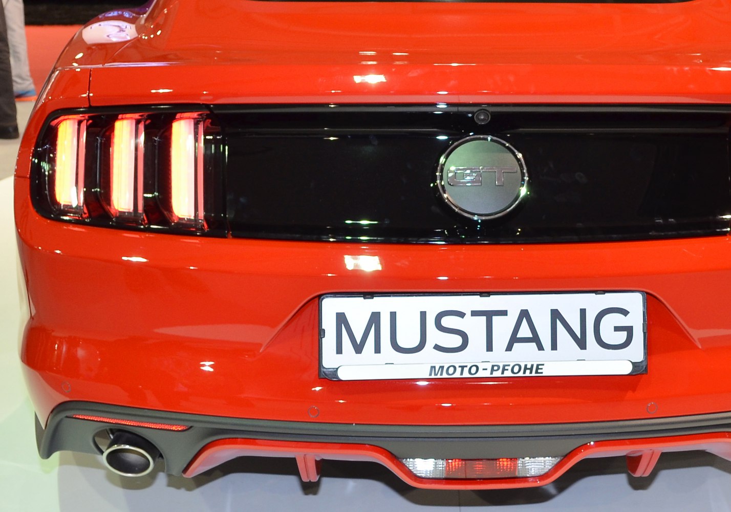 Rear view with GT badge and triple vertical tail lights
