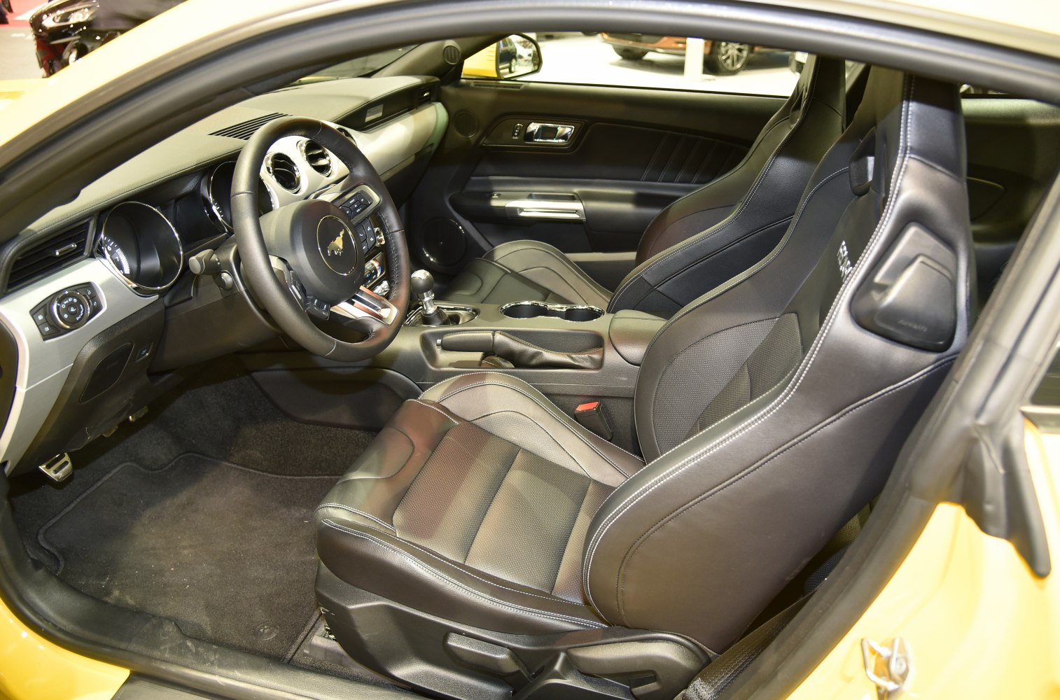 Sport leather seats with manual gear shifter in car interior