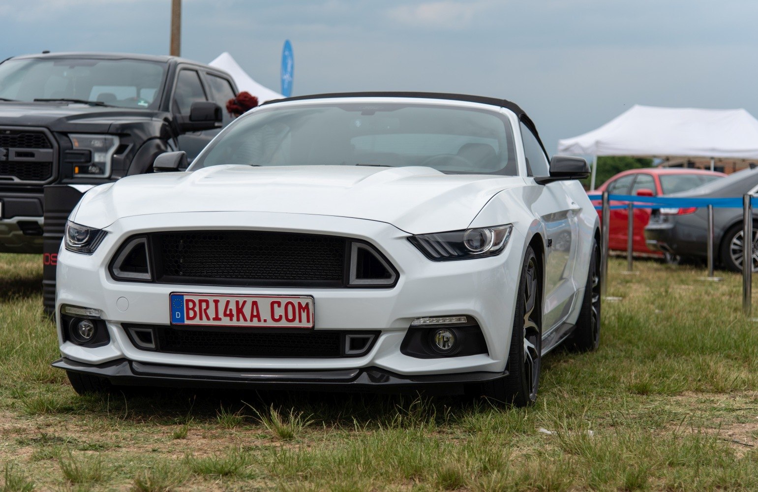 Sporty convertible front with aggressive grille and sleek headlights