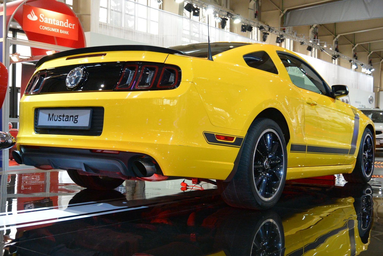 Yellow Mustang V facelift 2012 rear with distinctive taillights and black rims