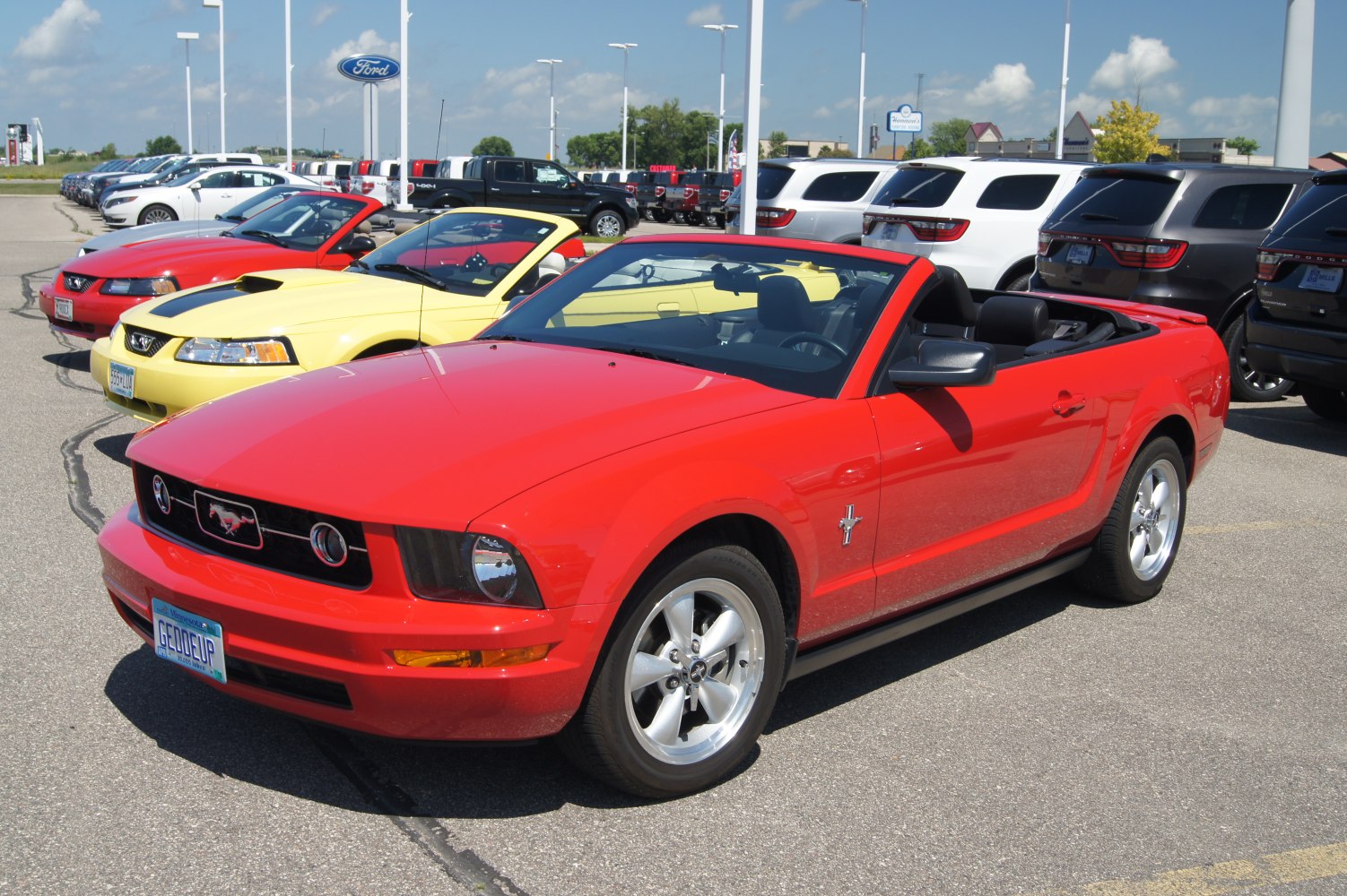 Convertible muscle car front and side view with alloy wheels
