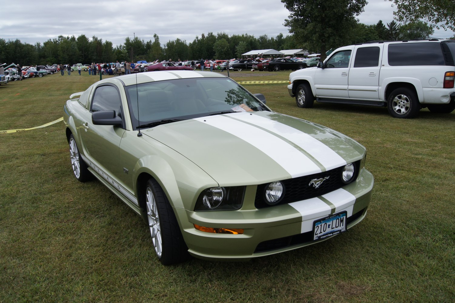 Front view of a muscle coupe with bold racing stripes