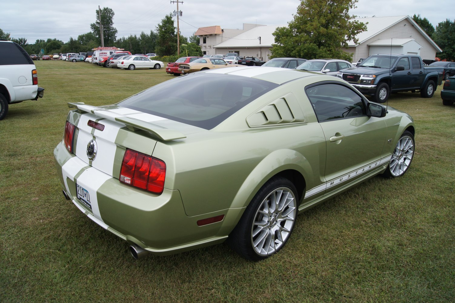 Rear and side view with racing stripes and rear spoiler