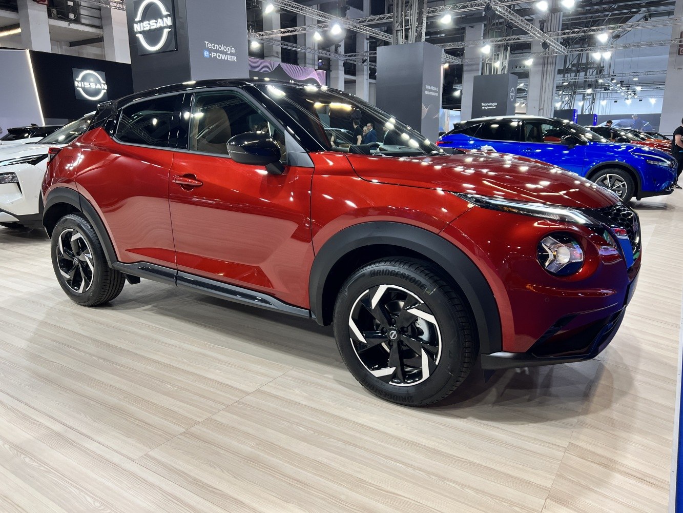 Red compact SUV with angular design and black roof