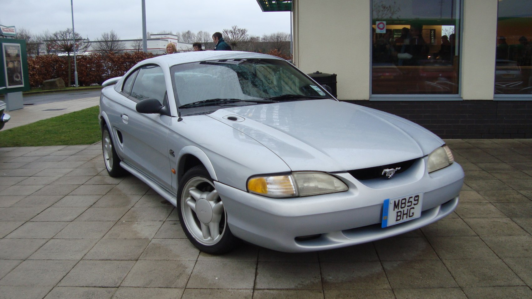 Front three-quarter view with hood air scoop and integrated headlights