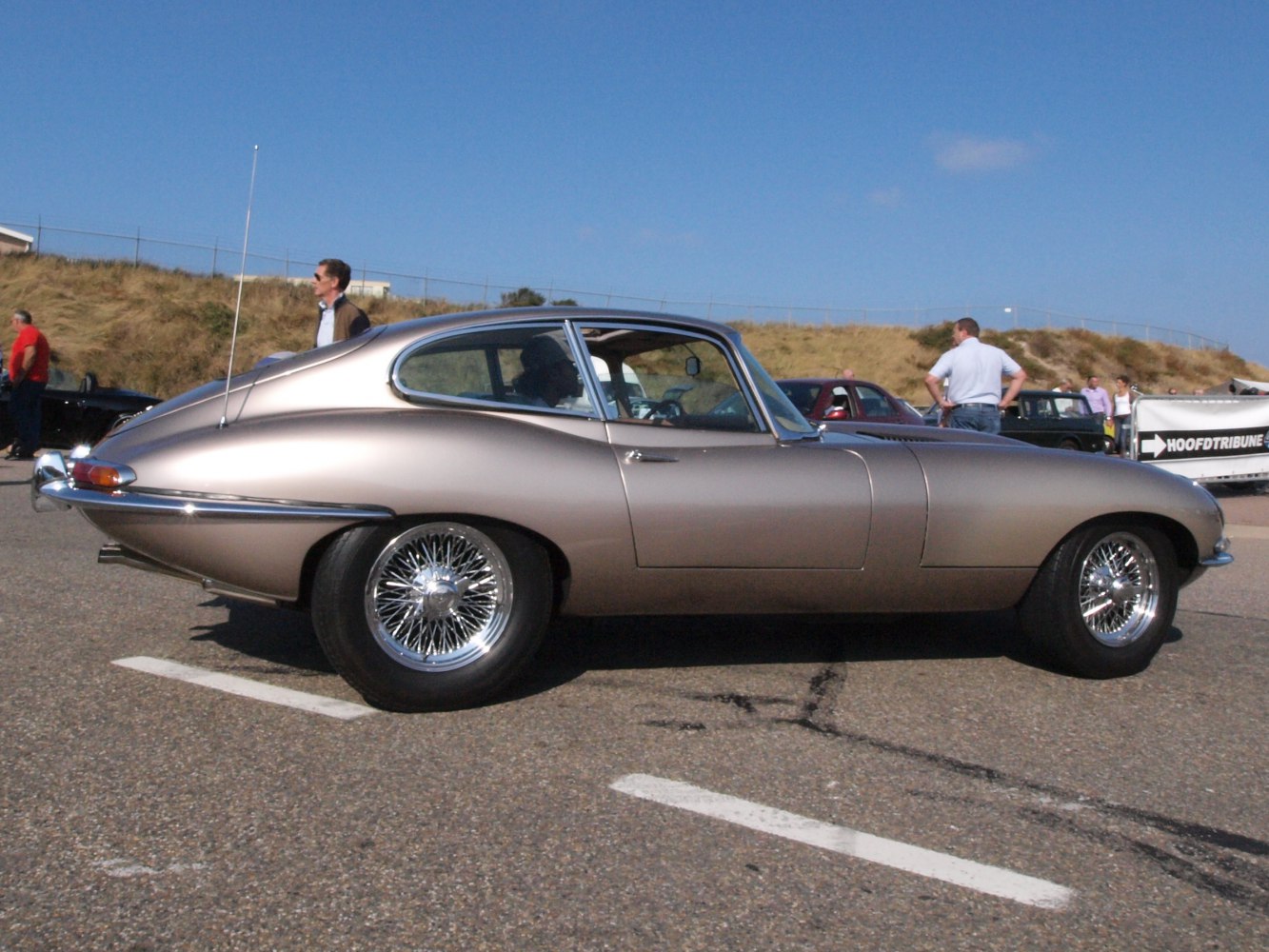 Smooth coupe silhouette with classic wire spoke wheels