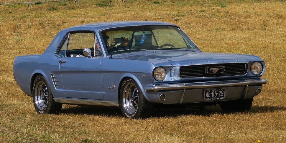 Light blue 1965 classic muscle car with signature grille and polished wheels