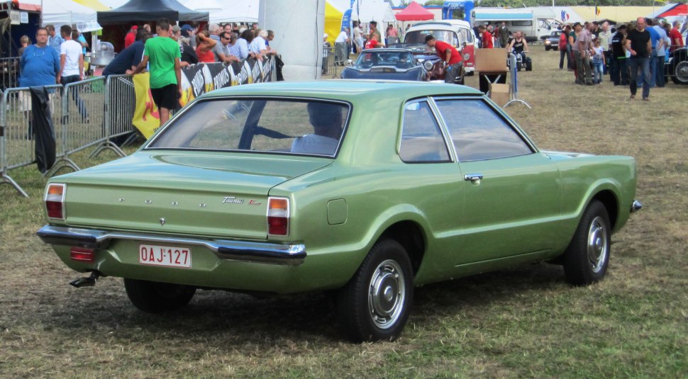 Vintage coupe rear view with chrome bumper and angular rear window design