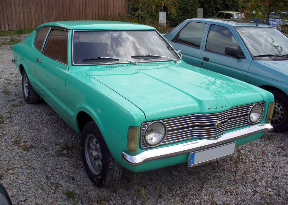 Sharp-lined vintage coupe with distinctive front grille and round headlights