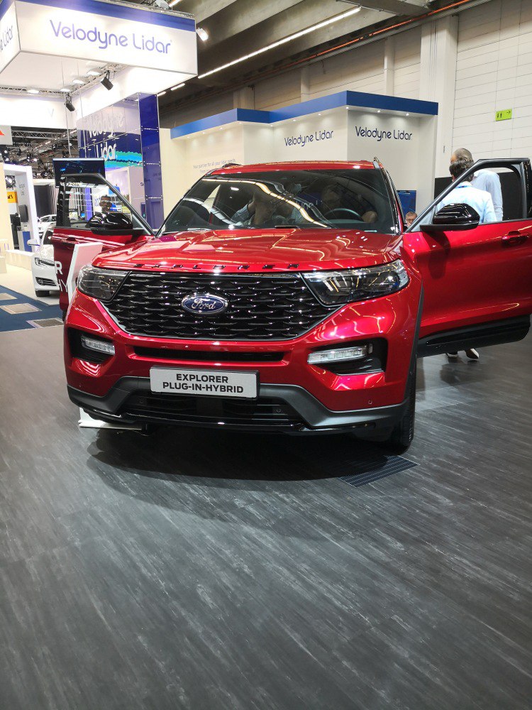Front grille and headlights of a red plug-in hybrid SUV