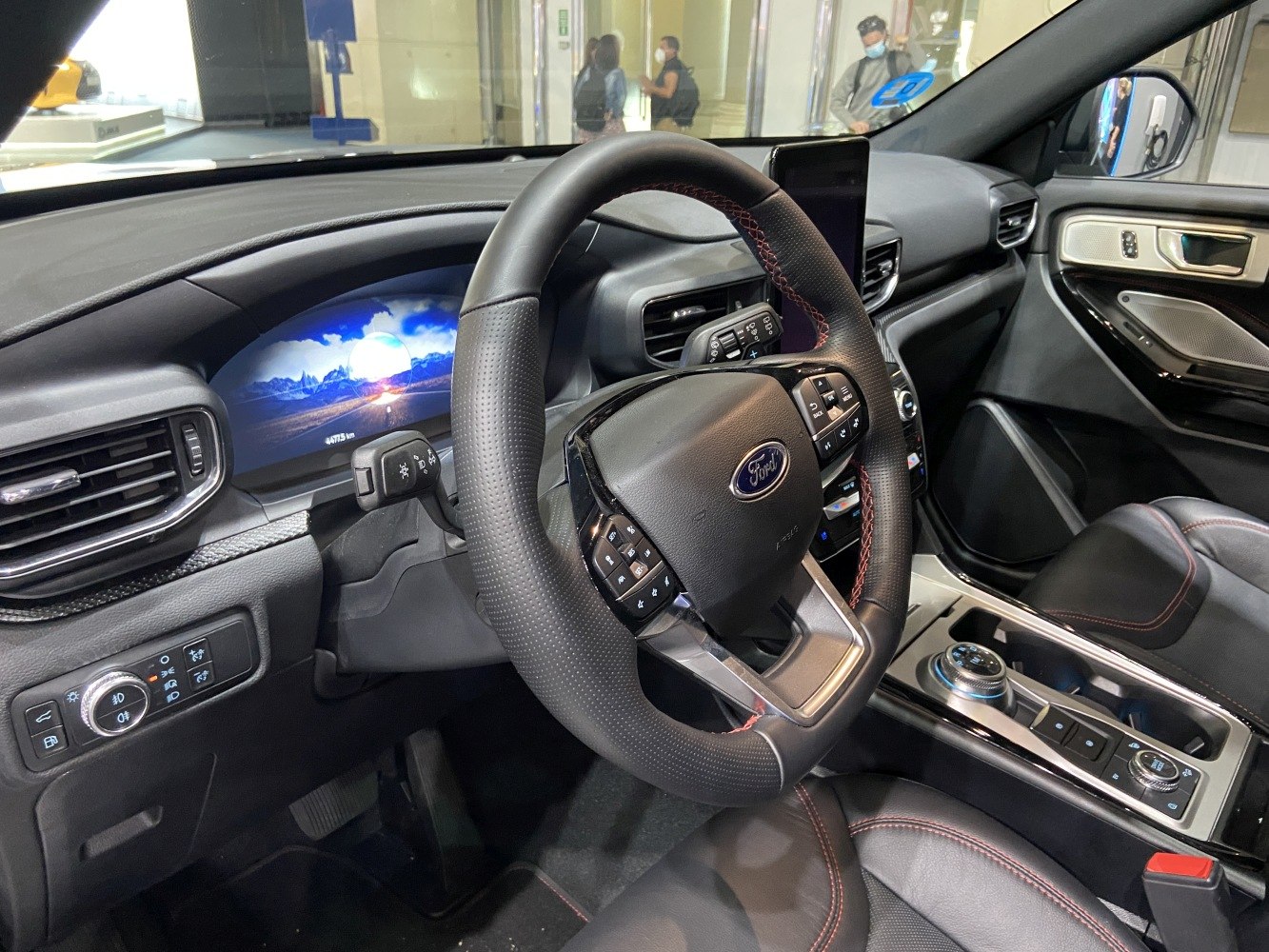 Digital dashboard and multifunction steering wheel with modern center console.
