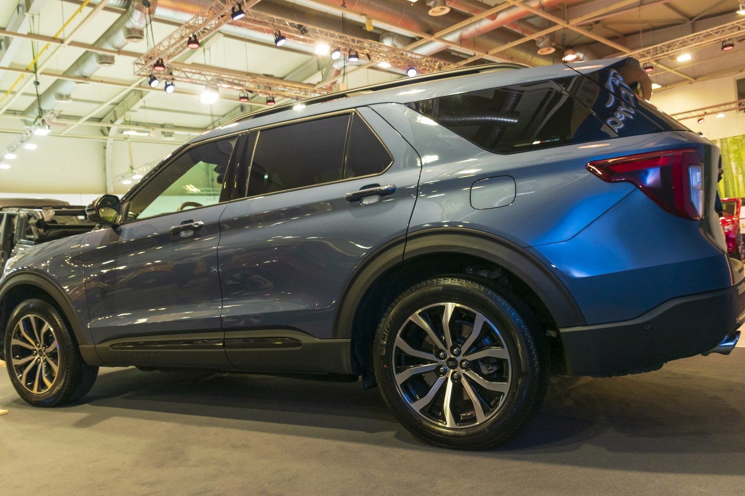 Side profile of SUV emphasizing alloy wheels and rear styling