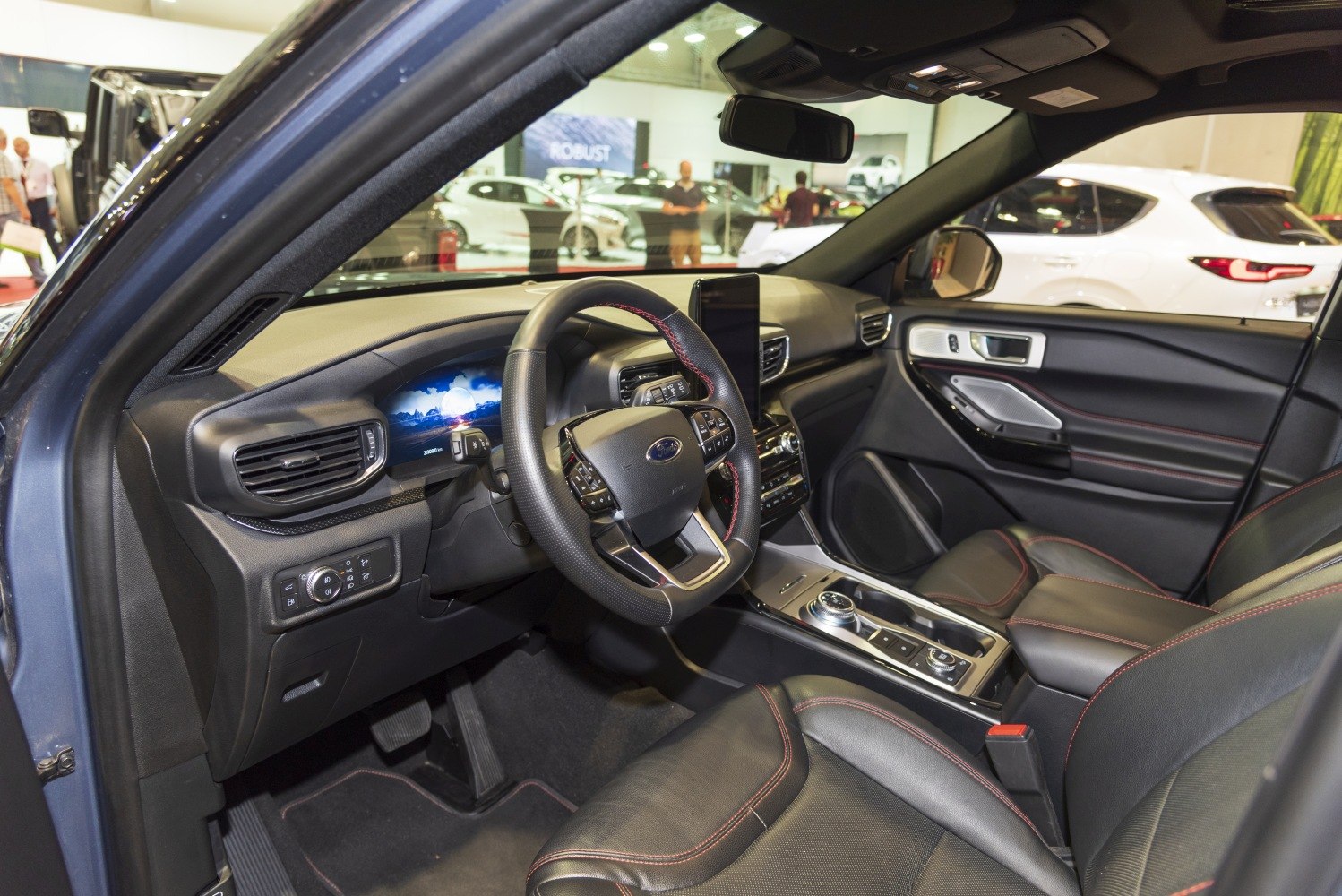Modern SUV interior with digital dashboard and leather seats