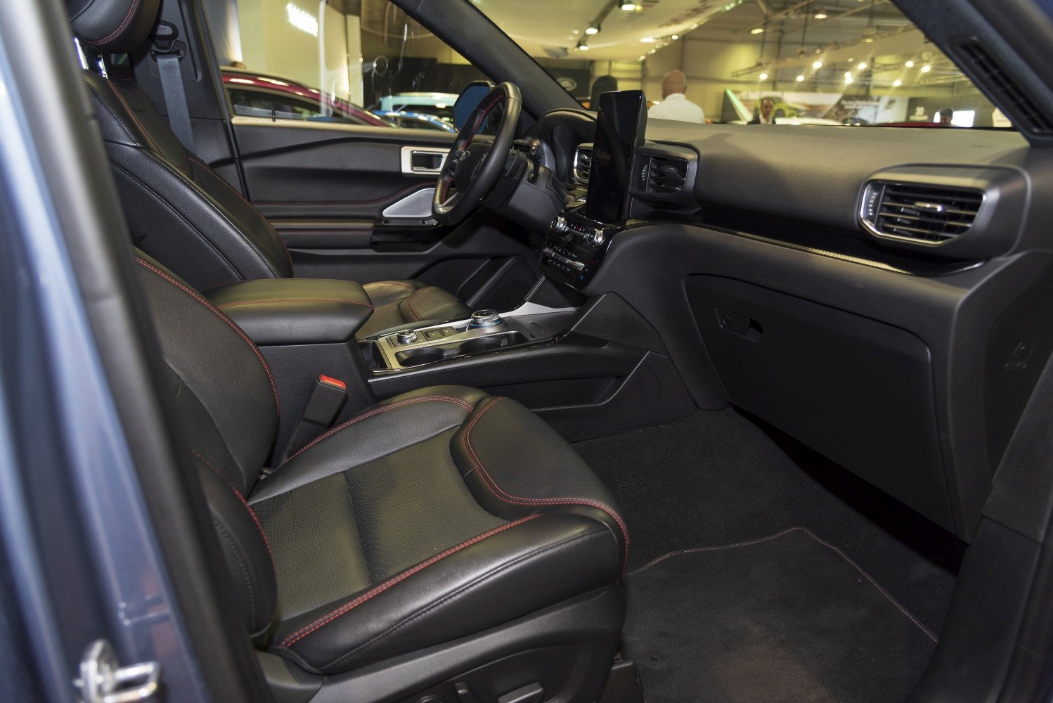 Leather front seats and a vertical touchscreen digital dashboard