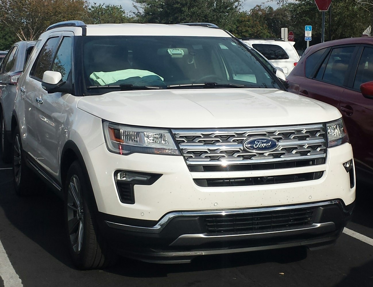 Front view with chrome grille and headlights