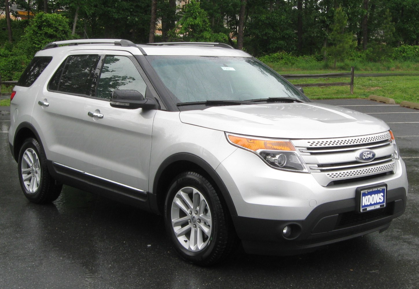 Silver SUV front and side view with roof rails and alloy wheels
