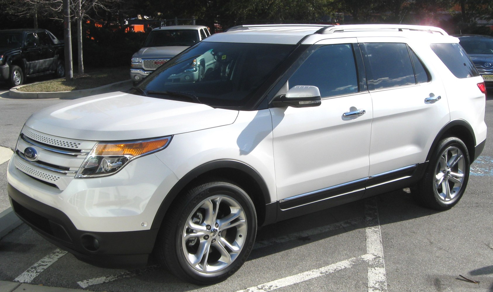 SUV side profile with sleek headlights and alloy wheels