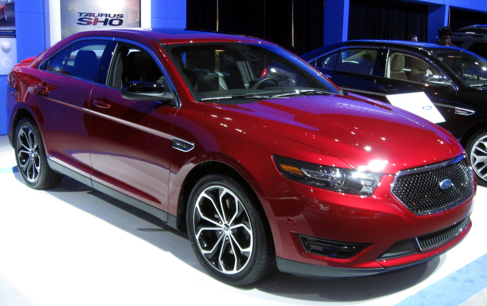 Red sedan with LED headlights and sporty alloy wheels