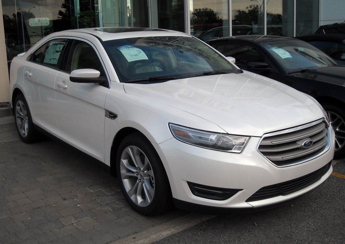 Front-side view showing headlight and grille design.