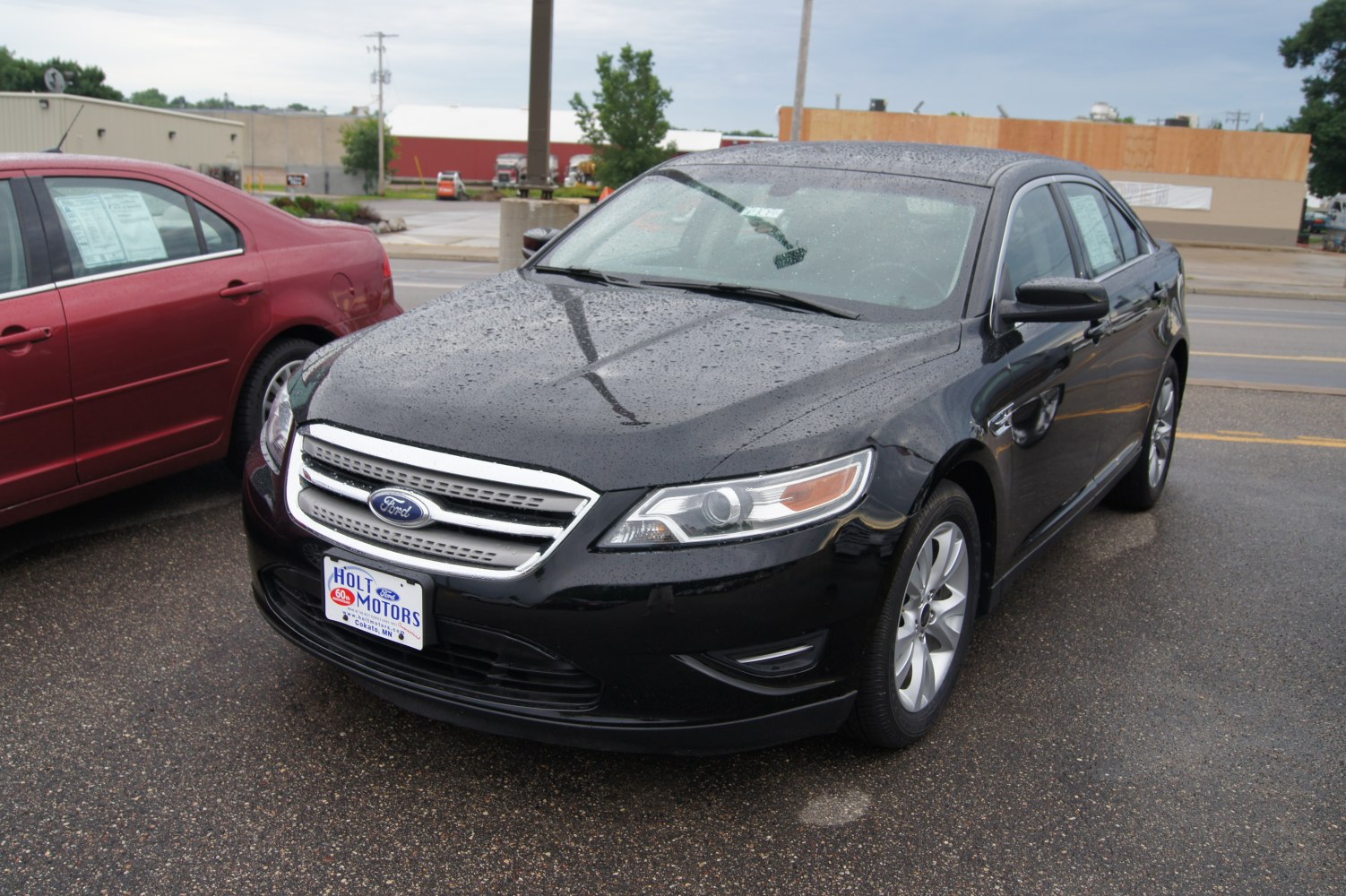Front and side view with chrome grille and headlights in rain