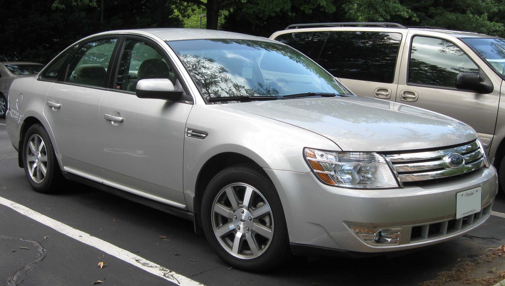 Silver sedan with chrome grille and alloy wheels