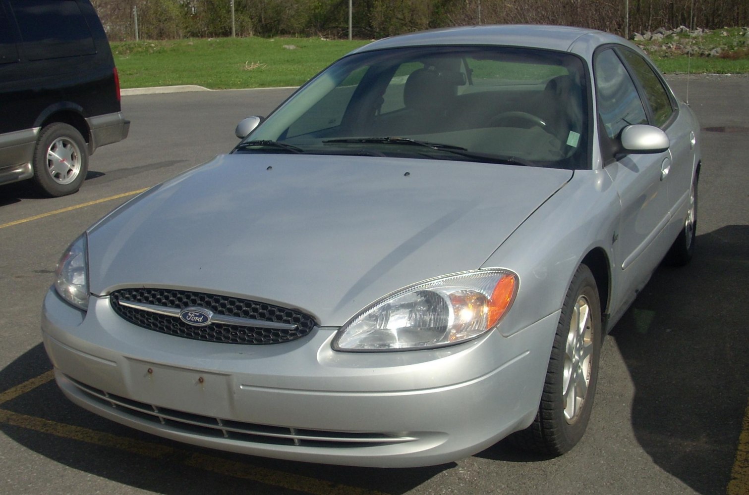 Front angle showing honeycomb grille and rounded headlights