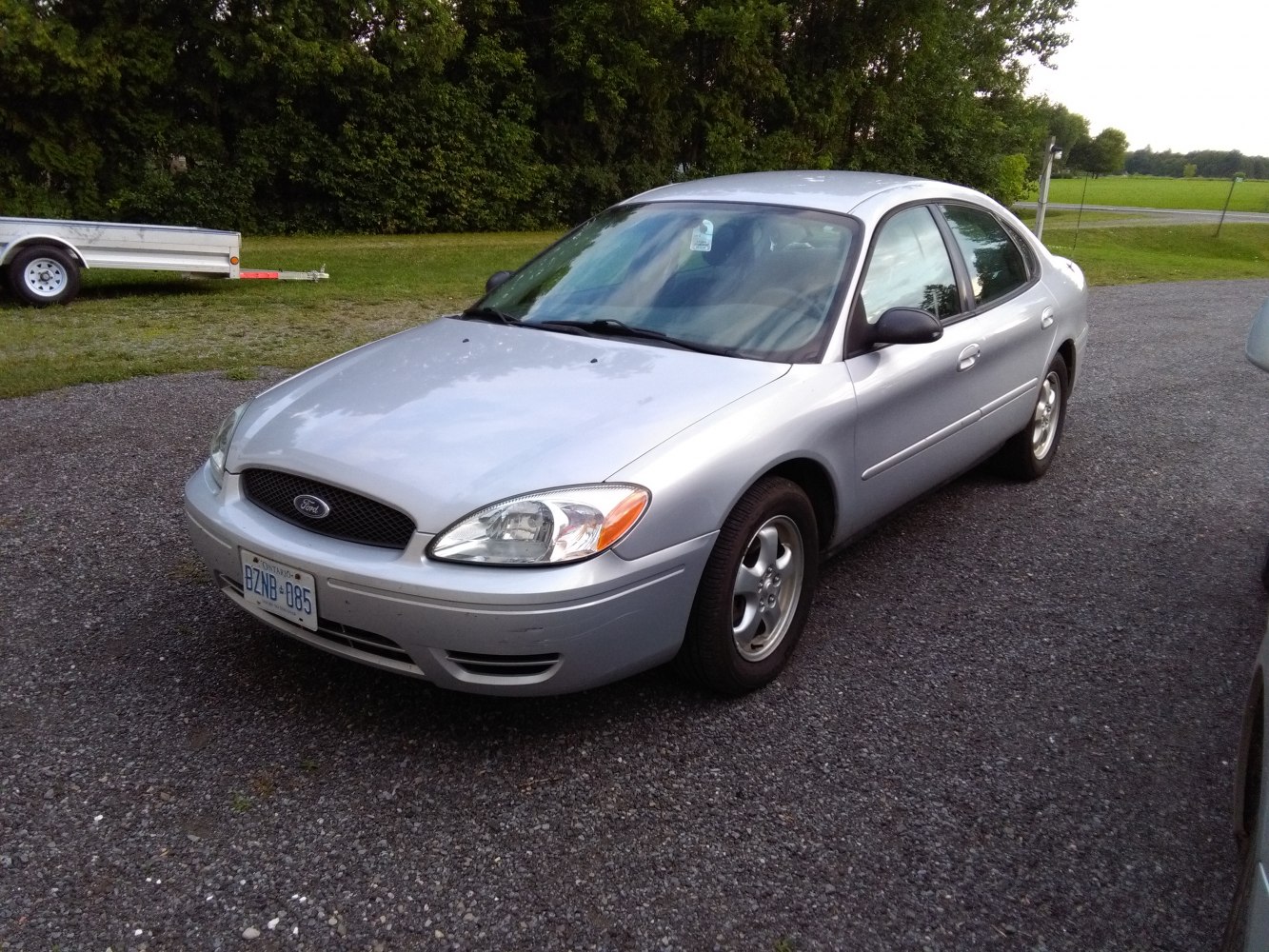 Silver sedan with rounded headlights and mesh grille