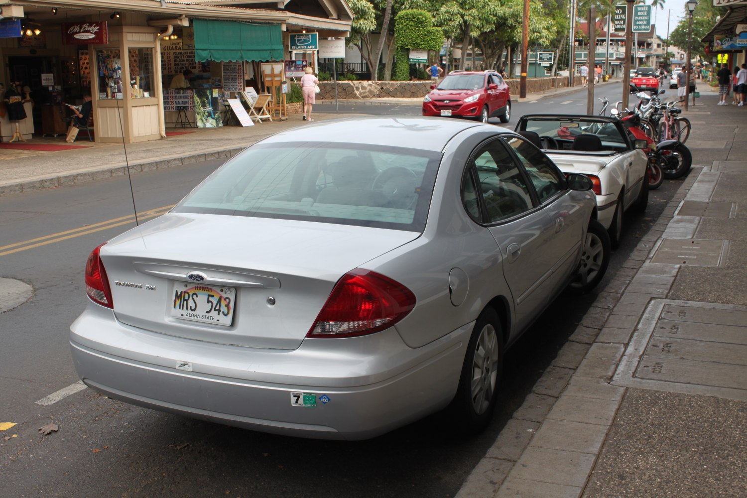 Rear view of a sedan with smooth trunk and distinctive taillights