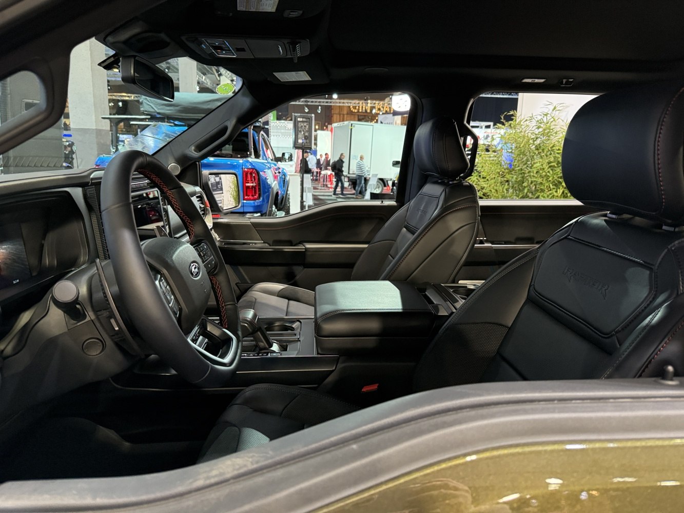 Modern truck interior with leather seats and steering wheel