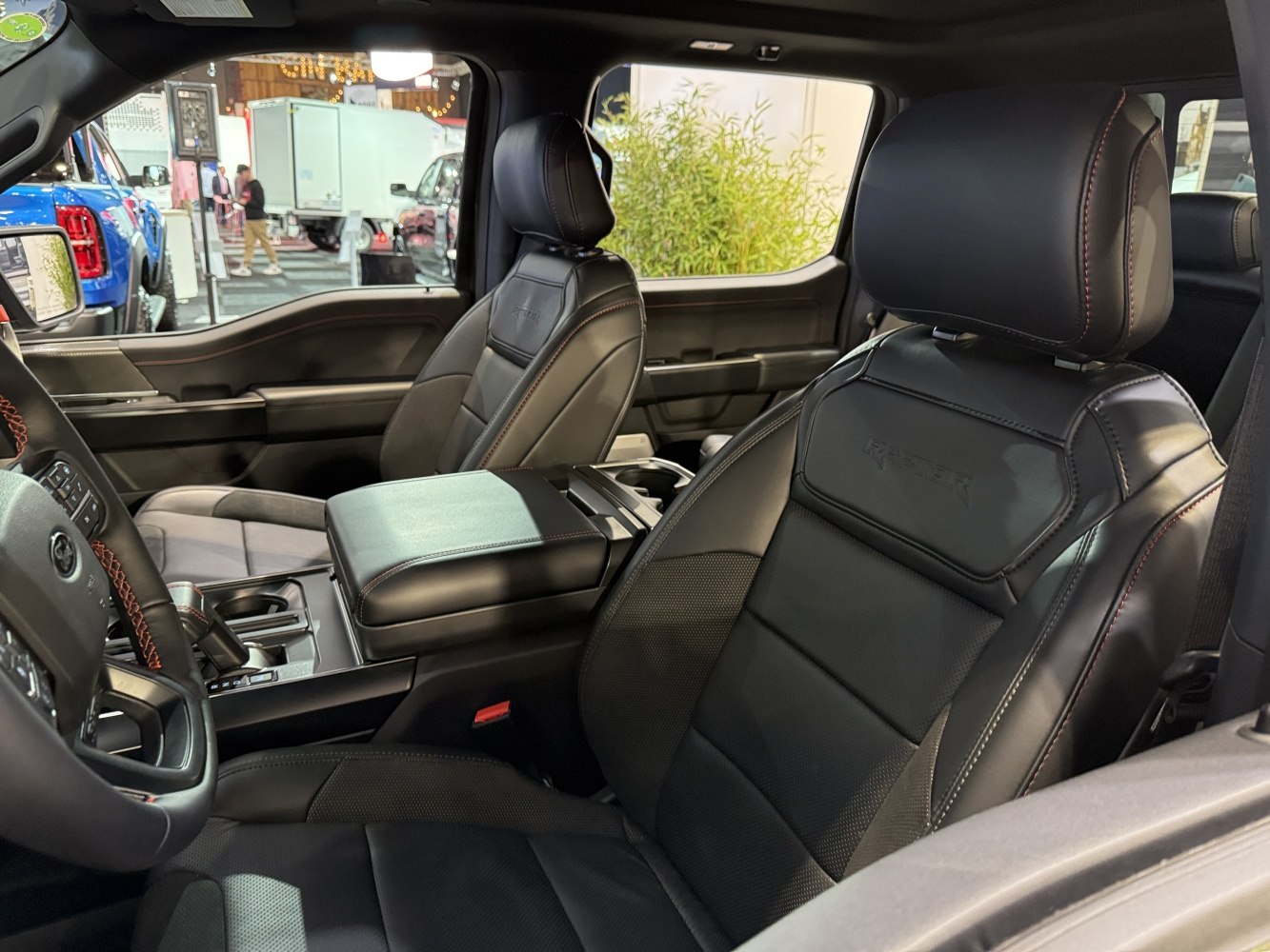 Premium leather seats with detailed stitching and spacious center console