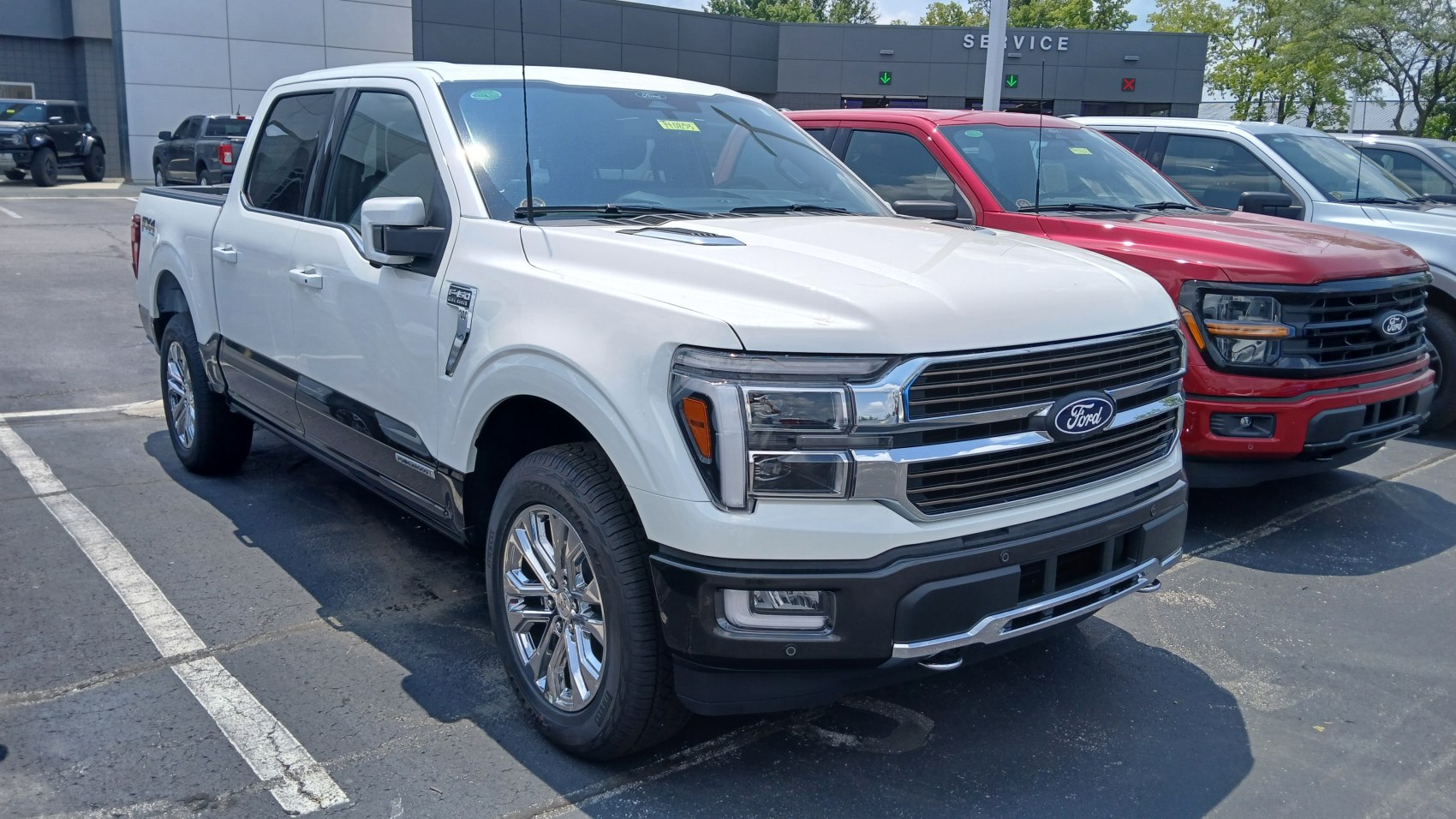 Chrome grille and alloy wheels on a modern full-size pickup truck